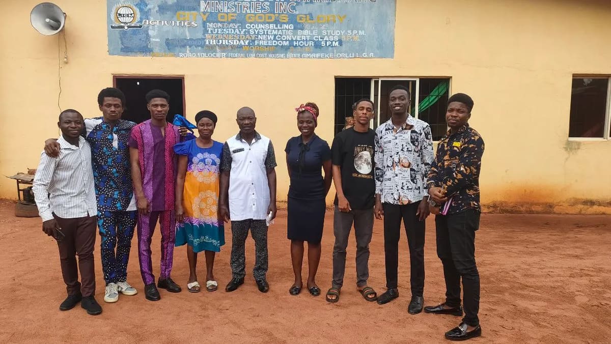 The mission team standing together outside a church building
