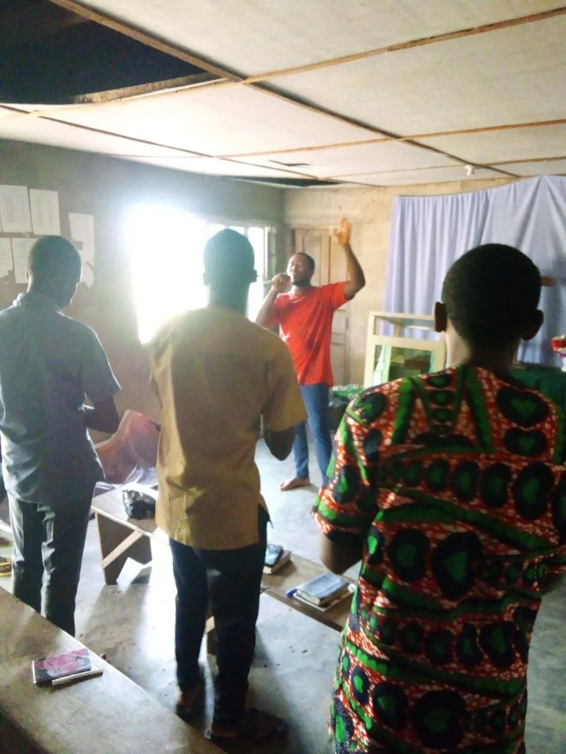 Team members praying inside a church
