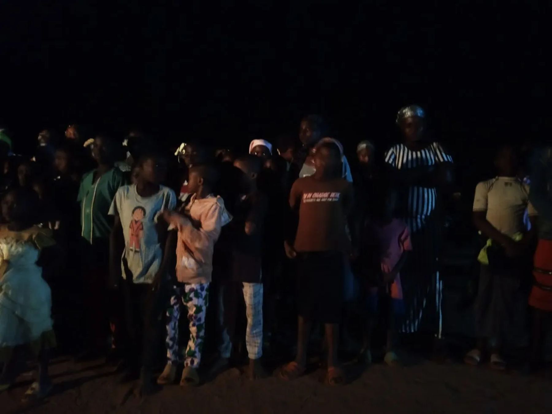 Children and adults gathered at the night meeting