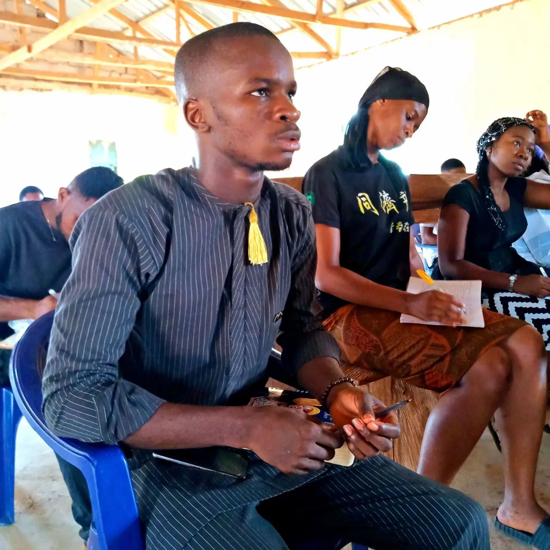 Participants seated, taking notes
