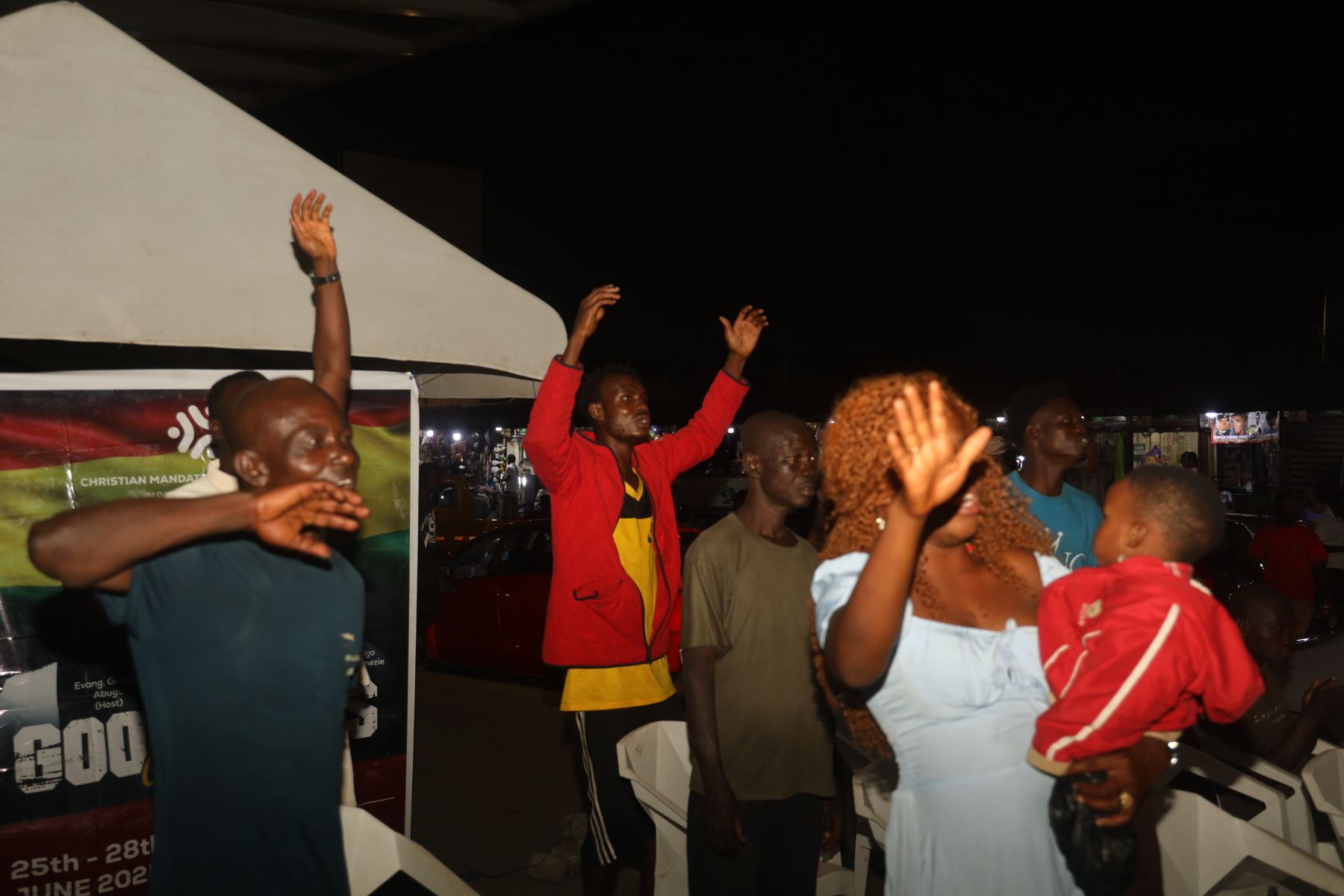 Community participants worshipping the Lord