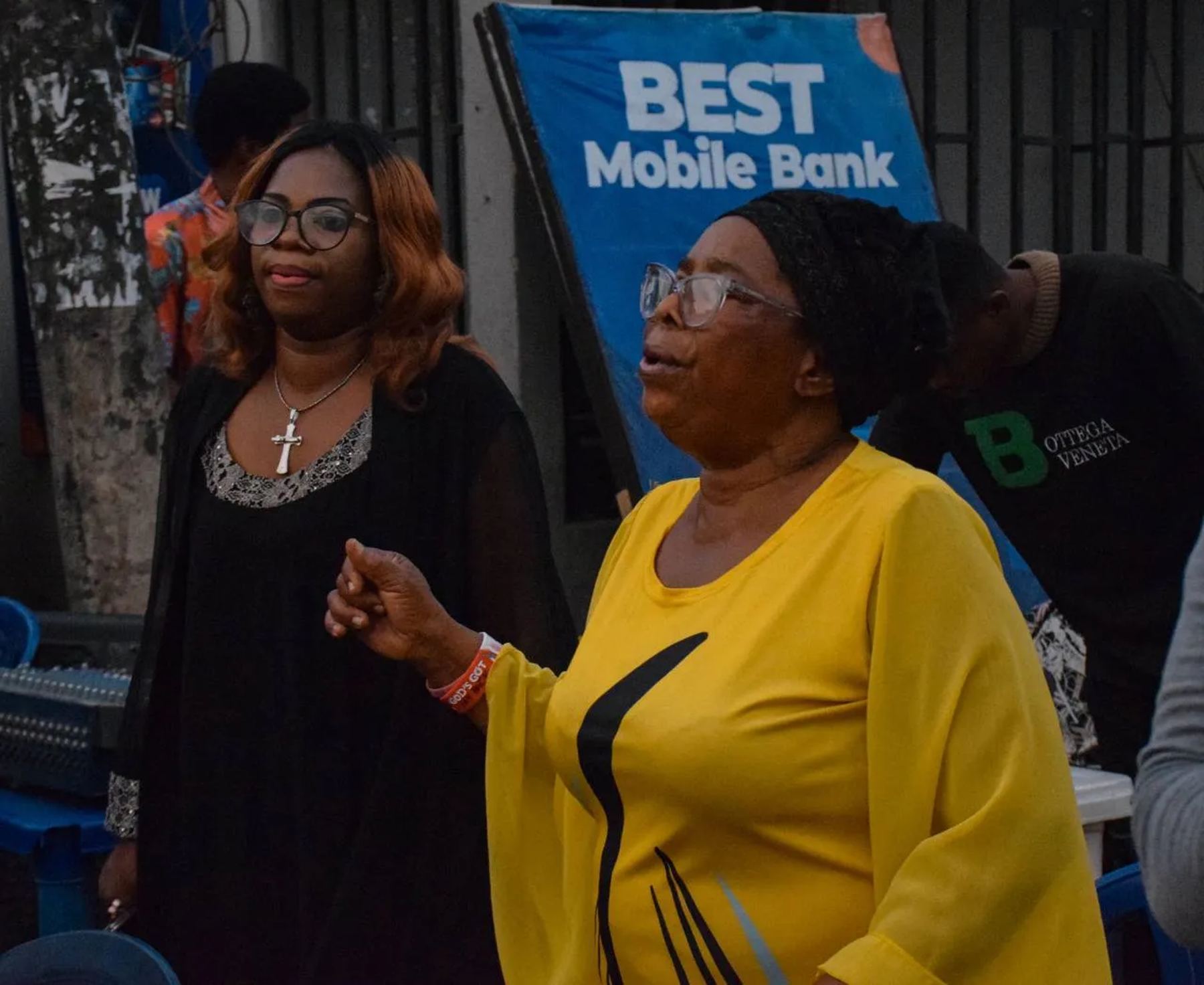 Two women speaking at the outreach in the street