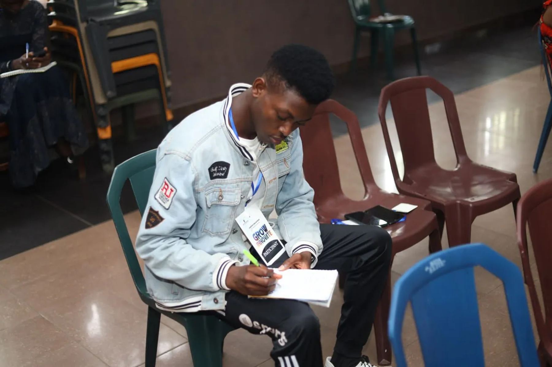 A participant taking notes