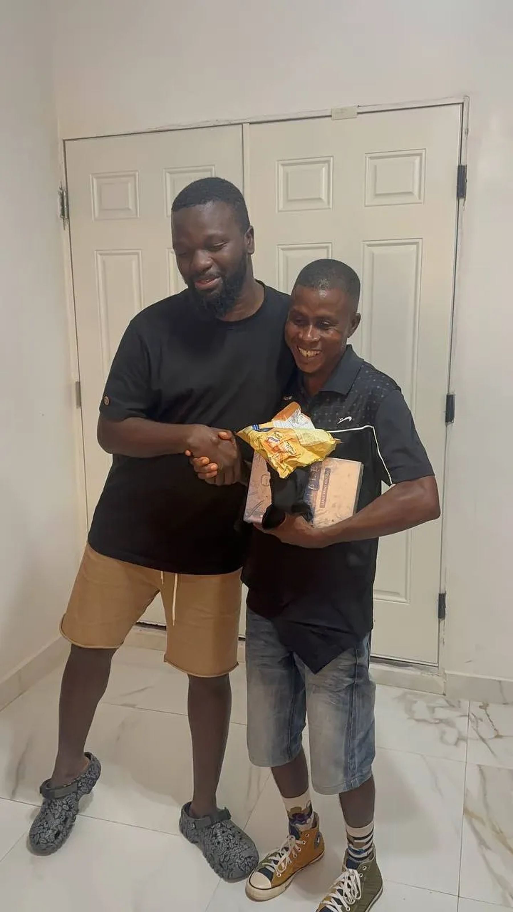 Two team members exchanging a gift